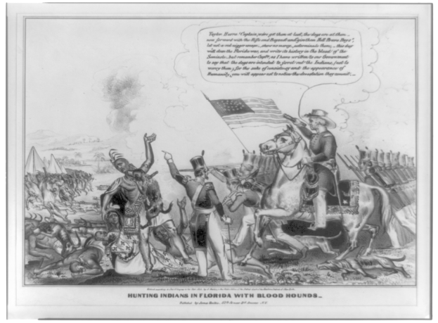 Schwarzes und weißes Foto einer Gruppe von Menschen, einige sitzen auf Pferden, mit einer Fahne im Hintergrund und Text, der unten 'Indianerjagd in Florida mit Bluthunden' lautet.