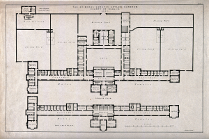 Schwarz-weißer Architekturplan eines Gebäudes mit zahlreichen beschrifteten Räumen, darunter eine 'Irrenanstalt für Verbrecher'.